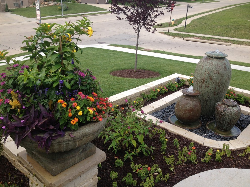 Small traditional garden in Omaha with a container garden.