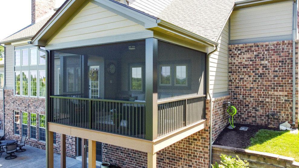 Photo of a small back private and first floor metal railing terrace in St Louis with a roof extension.