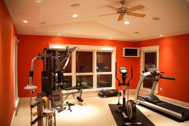 home gym with orange painted walls