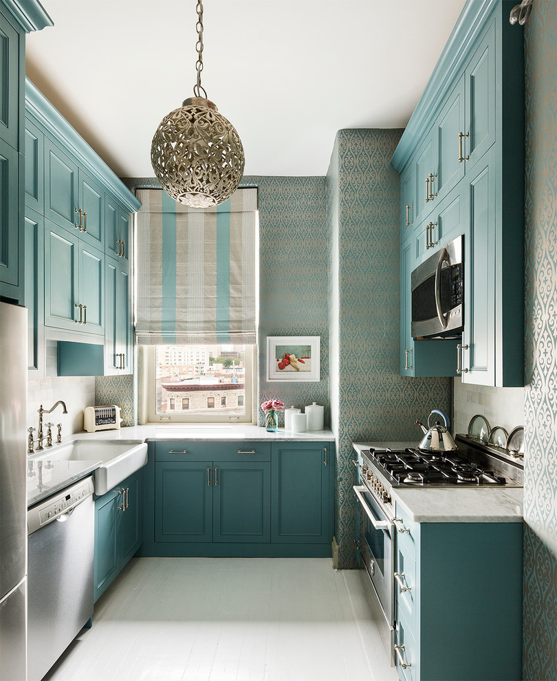 This is an example of a small transitional u-shaped separate kitchen in New York with a farmhouse sink, shaker cabinets, marble benchtops, stainless steel appliances, no island and turquoise cabinets.