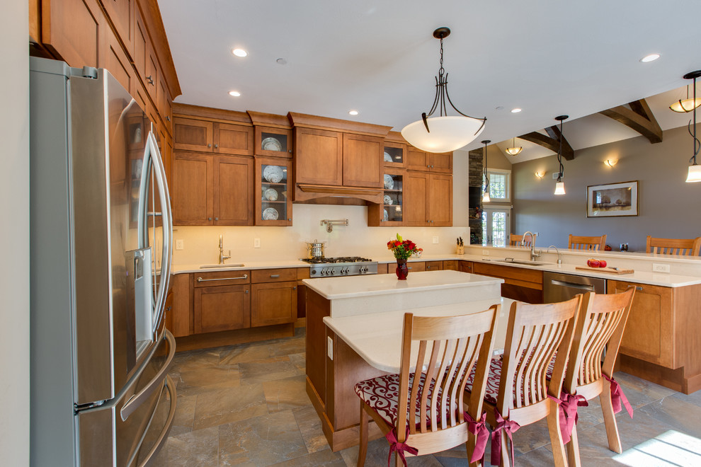 Open concept kitchen - huge transitional u-shaped open concept kitchen idea in Boston with an undermount sink, shaker cabinets, medium tone wood cabinets, quartz countertops, stone slab backsplash, stainless steel appliances and an island