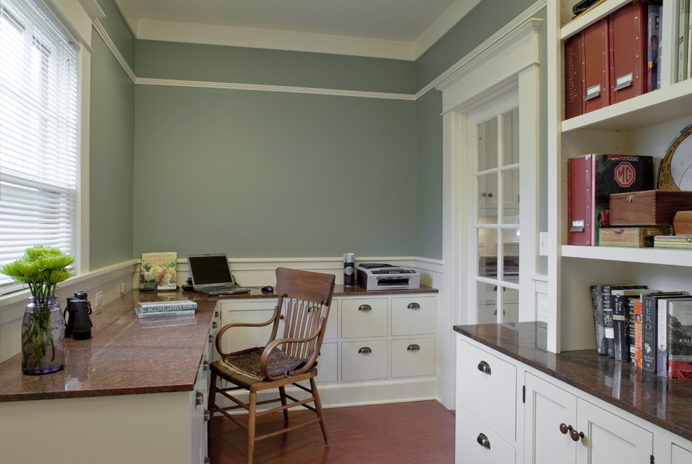 Photo of a mid-sized arts and crafts home office in Portland with green walls, linoleum floors, no fireplace and a built-in desk.