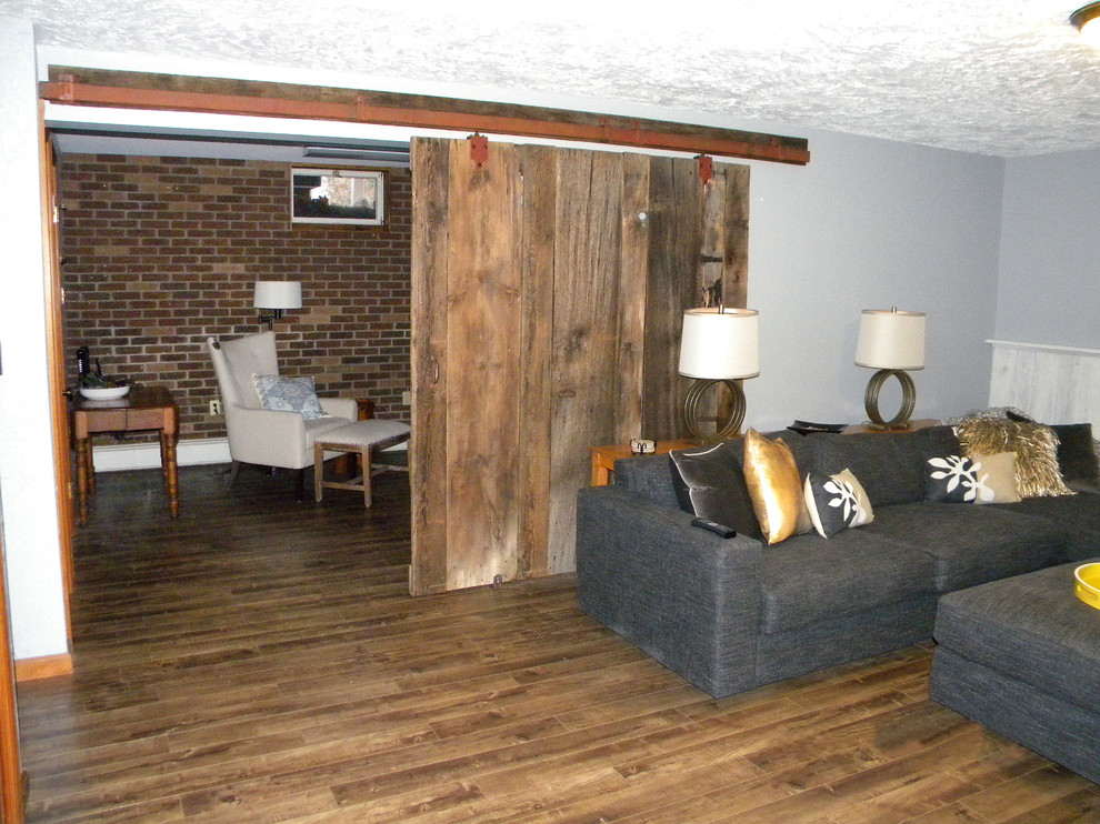 Mid-sized mountain style underground ceramic tile basement photo with gray walls