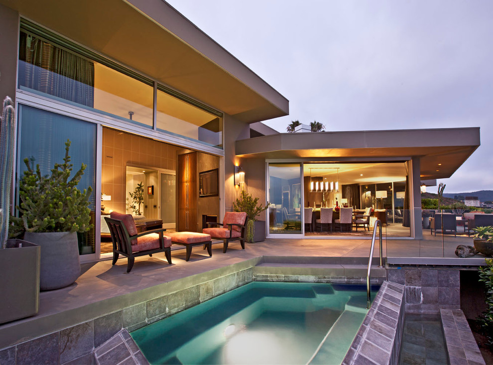 Inspiration for a contemporary pool in Orange County with a hot tub.