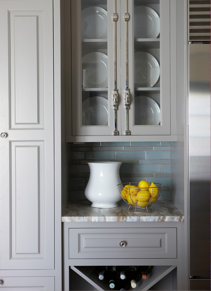 Inspiration for a traditional eat-in kitchen in Boston with raised-panel cabinets, grey cabinets, an undermount sink, quartz benchtops, blue splashback, ceramic splashback, stainless steel appliances and medium hardwood floors.