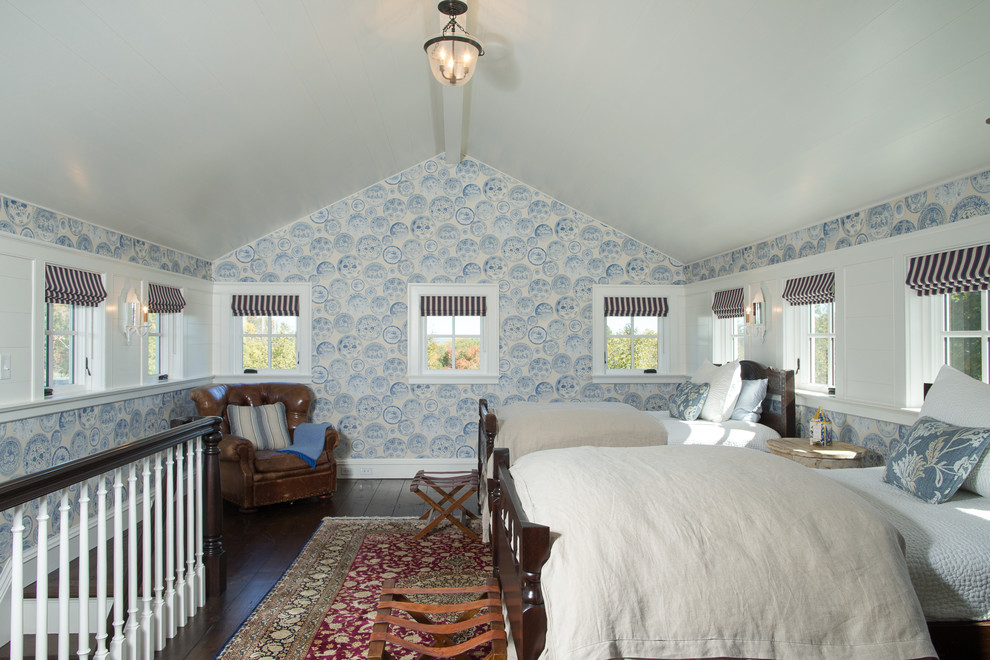 This is an example of a mid-sized country loft-style bedroom in New York with blue walls, dark hardwood floors, no fireplace and brown floor.