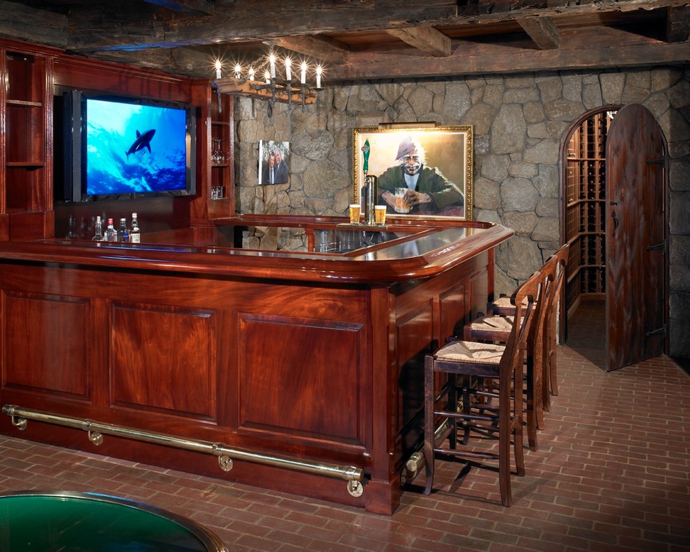 Photo of a large beach style wine cellar in Boston with brick floors and diamond bins.