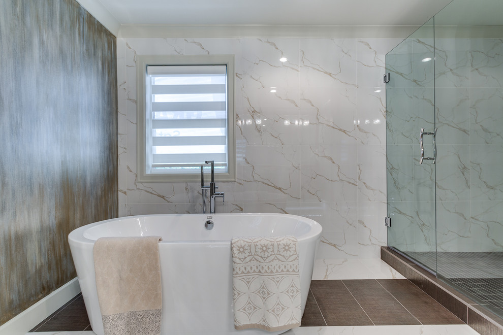 Inspiration for a transitional master bathroom in Vancouver with beige cabinets, a freestanding tub, a corner shower, a one-piece toilet, multi-coloured walls, an undermount sink, multi-coloured floor and a hinged shower door.