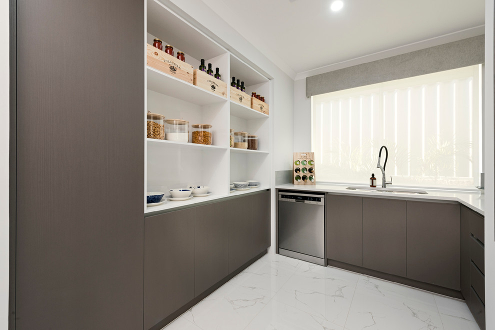 This is an example of a large contemporary galley open plan kitchen in Perth with an undermount sink, flat-panel cabinets, dark wood cabinets, quartz benchtops, glass sheet splashback, stainless steel appliances, porcelain floors, with island and white floor.