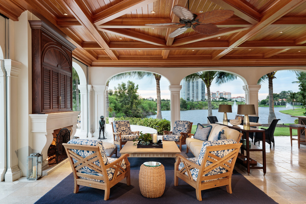 Design ideas for a tropical patio in Miami with a roof extension.