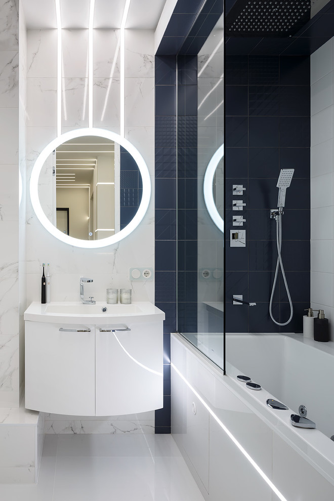 Inspiration for a small contemporary master bathroom in Saint Petersburg with flat-panel cabinets, white cabinets, a shower/bathtub combo, porcelain tile, porcelain floors, white floor, an alcove tub, white tile, black tile and a drop-in sink.