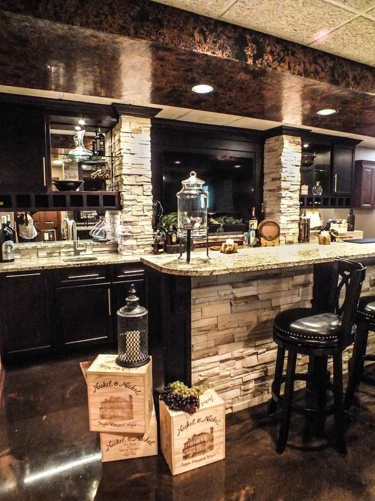Design ideas for a traditional home bar in Cleveland.