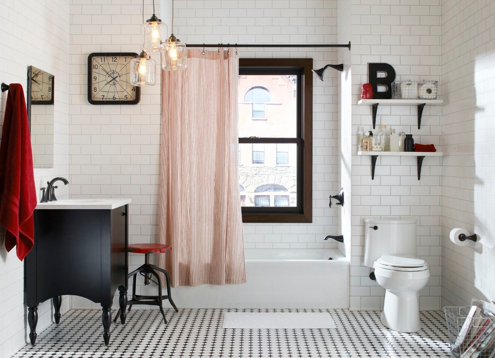Drop-in bathtub - mid-sized transitional master white tile and subway tile drop-in bathtub idea in Seattle with a pedestal sink, white walls, black cabinets and a two-piece toilet