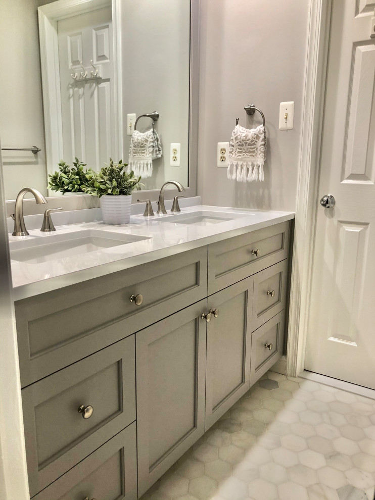 Photo of a small country kids bathroom in DC Metro with recessed-panel cabinets, grey cabinets, an alcove tub, a two-piece toilet, white tile, porcelain tile, grey walls, marble floors, an undermount sink, engineered quartz benchtops, white benchtops, a double vanity and a built-in vanity.