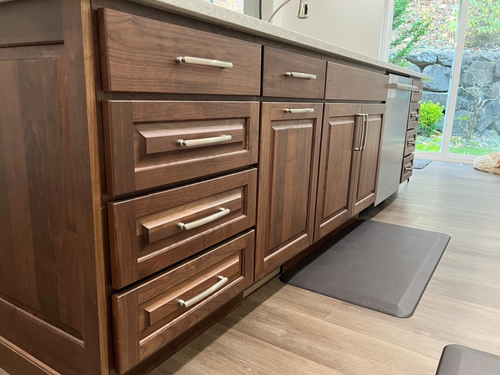 Eat-in kitchen - large transitional l-shaped vinyl floor eat-in kitchen idea in Seattle with an undermount sink, quartz countertops, gray backsplash, porcelain backsplash, stainless steel appliances, an island, white countertops, raised-panel cabinets and medium tone wood cabinets