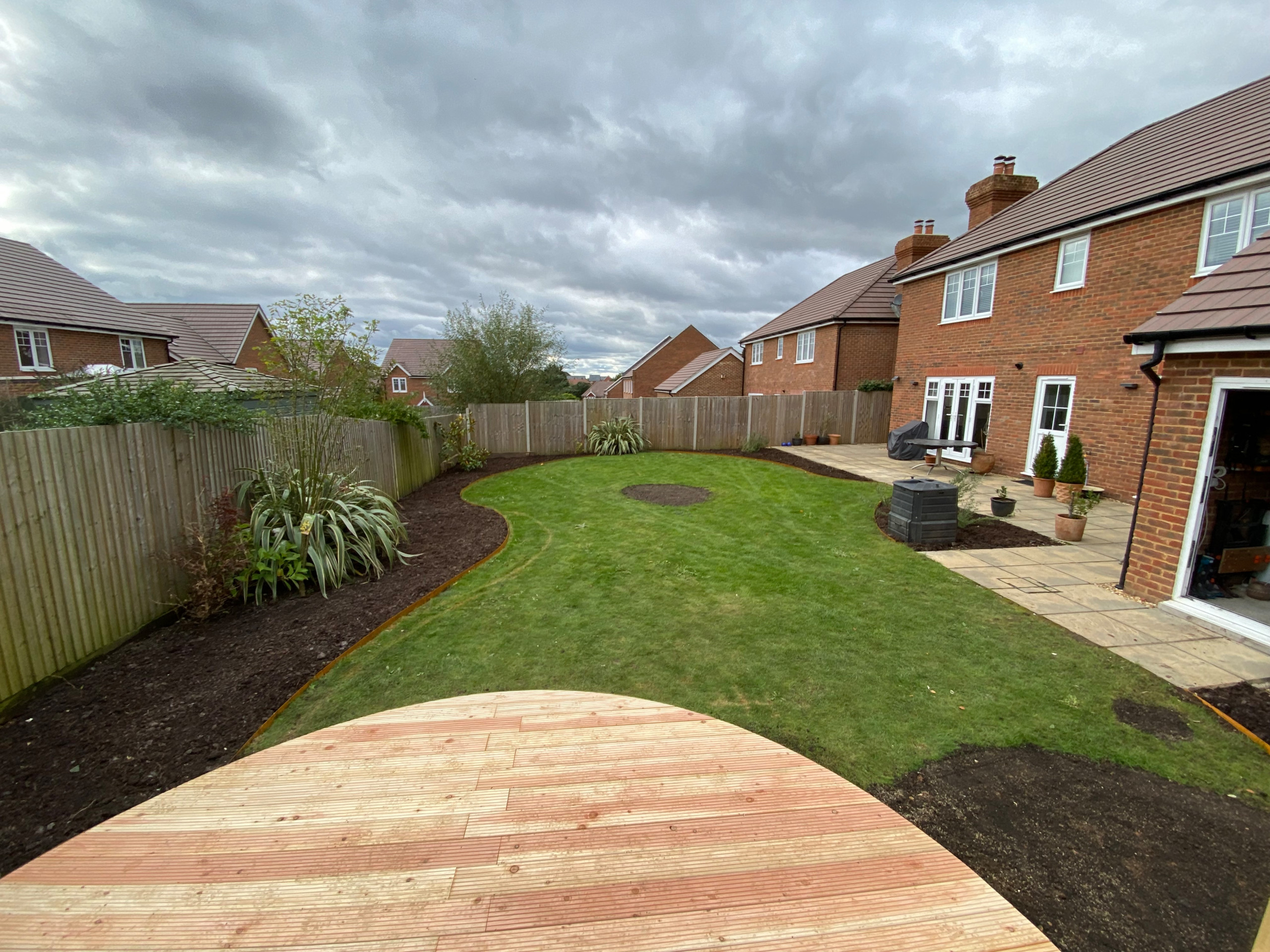 Modern Garden Design - Circular Decked Seating Area With CorTen Steel Screening