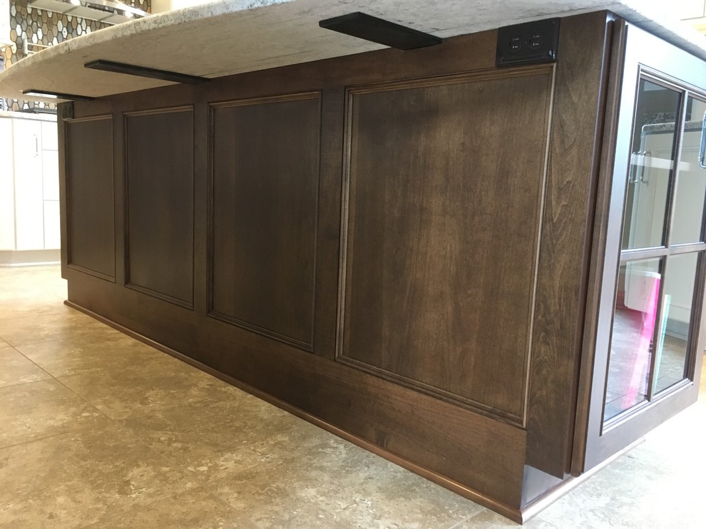 Inspiration for a large transitional l-shaped vinyl floor and beige floor eat-in kitchen remodel with a double-bowl sink, recessed-panel cabinets, white cabinets, granite countertops, brown backsplash, ceramic backsplash, stainless steel appliances and an island