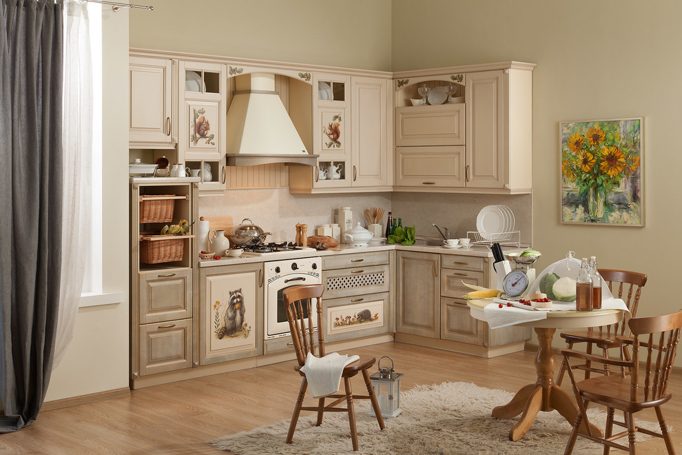 This is an example of a large country l-shaped separate kitchen in Moscow with a single-bowl sink, raised-panel cabinets, beige cabinets, laminate benchtops, beige splashback, coloured appliances, laminate floors, no island and beige benchtop.