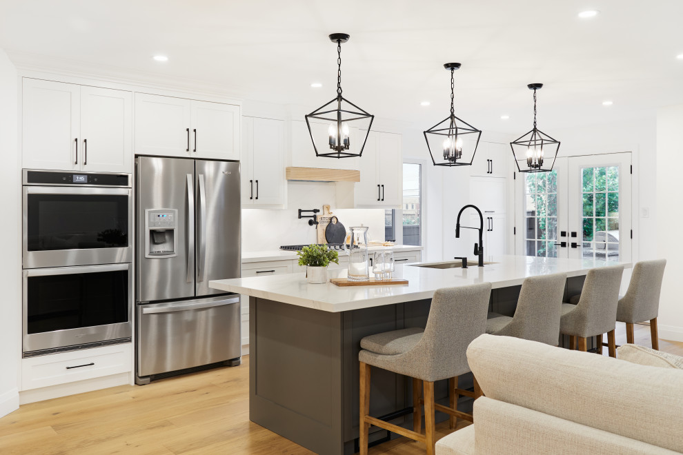 Example of a transitional kitchen design in Toronto
