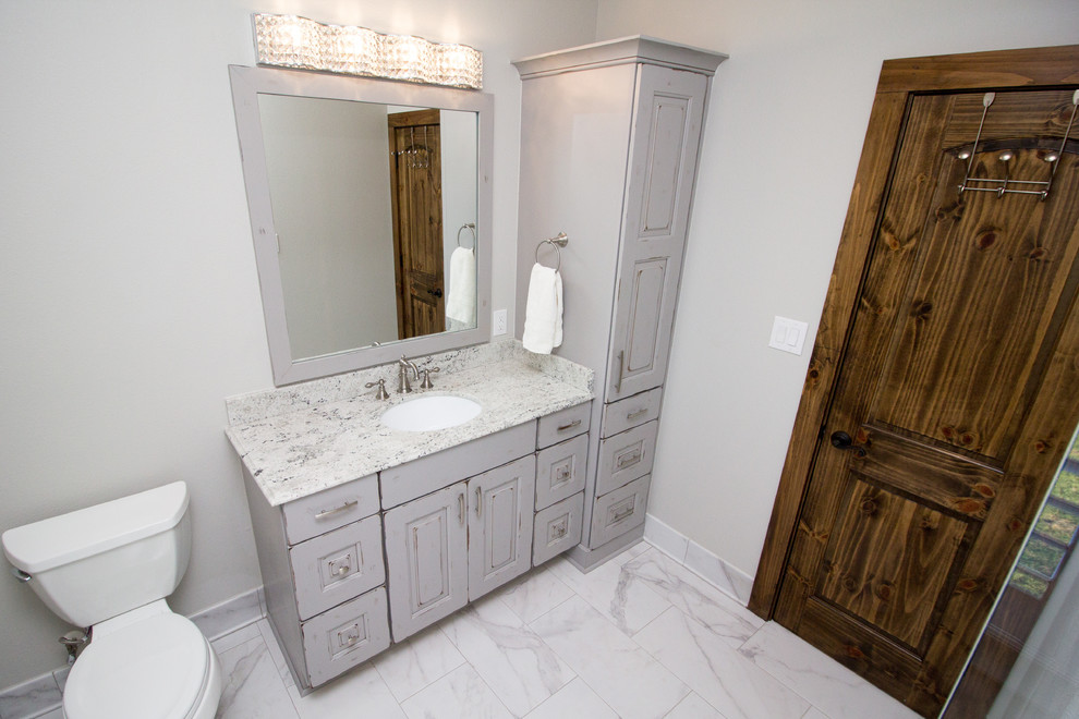 Example of a mid-sized classic kids' white tile and porcelain tile porcelain tile bathroom design in Houston with raised-panel cabinets, white cabinets, an undermount sink and granite countertops