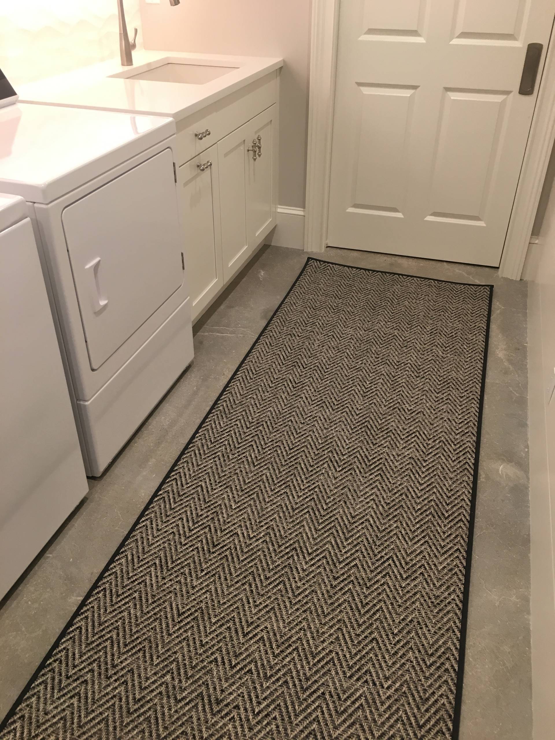A fully equipped laundry room with a built ins