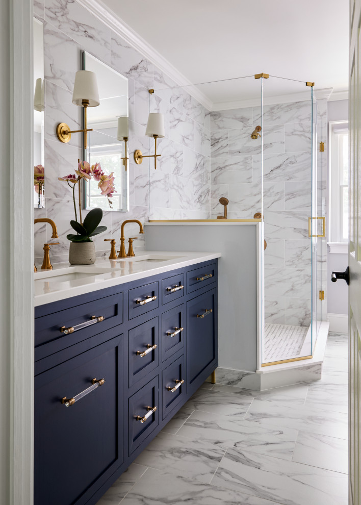Inspiration for a transitional gray tile and porcelain tile porcelain tile, gray floor and double-sink alcove shower remodel in Newark with shaker cabinets, blue cabinets, an undermount sink, quartz countertops, a hinged shower door, white countertops, a built-in vanity and gray walls