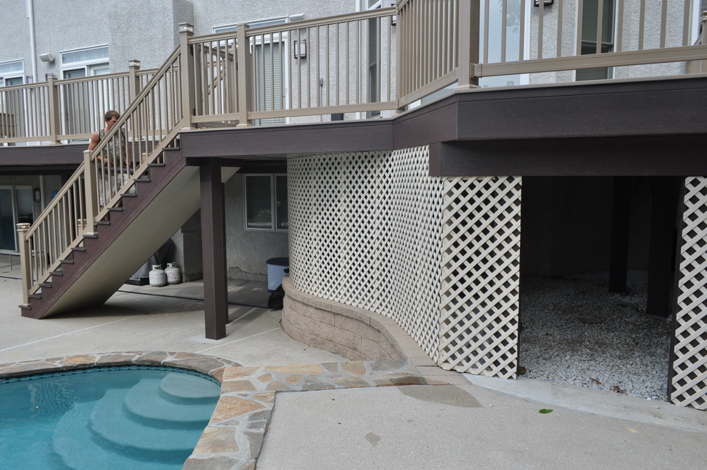Deck - mid-sized transitional backyard deck idea with no cover