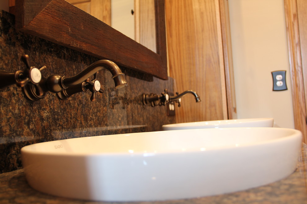Example of a transitional brown tile and porcelain tile porcelain tile tub/shower combo design in Columbus with a vessel sink, an undermount tub, a two-piece toilet, raised-panel cabinets, medium tone wood cabinets, granite countertops and beige walls