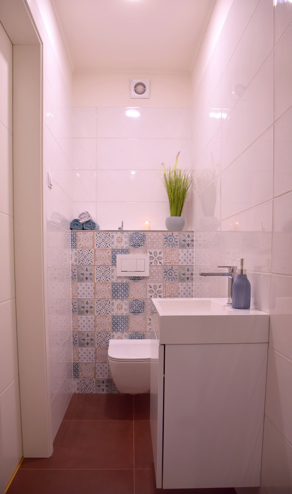 Photo of a small modern kids bathroom with an alcove shower, a one-piece toilet, white tile, ceramic tile, white walls, ceramic floors, wood benchtops, brown floor, a hinged shower door, white benchtops and a single vanity.