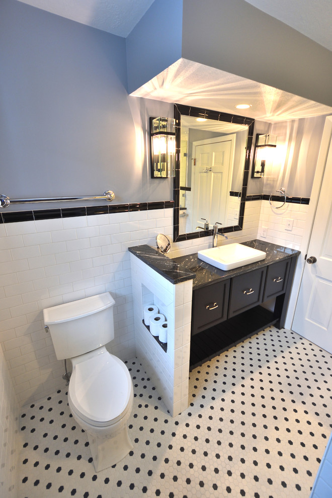 Inspiration for a mid-sized midcentury master bathroom in Other with furniture-like cabinets, black cabinets, an alcove shower, a two-piece toilet, white tile, subway tile, purple walls, mosaic tile floors, a vessel sink, granite benchtops, multi-coloured floor, a hinged shower door and black benchtops.