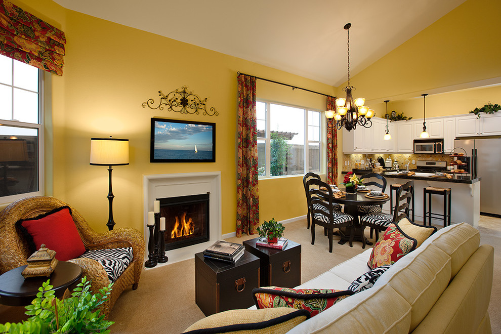 Design ideas for a large eclectic living room in Santa Barbara with yellow walls, a standard fireplace and a wall-mounted tv.