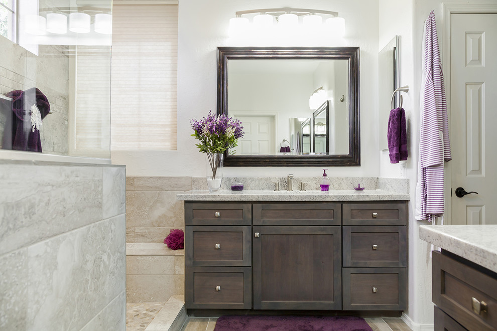 Inspiration for a mid-sized transitional master bathroom in Phoenix with recessed-panel cabinets, dark wood cabinets, an alcove shower, a one-piece toilet, beige tile, orange walls, porcelain floors, an undermount sink, granite benchtops, brown floor, an open shower and porcelain tile.