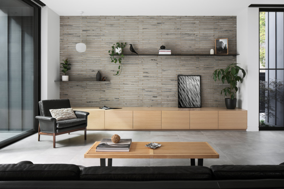 Modern living room in Melbourne with grey walls, ceramic floors and grey floor.