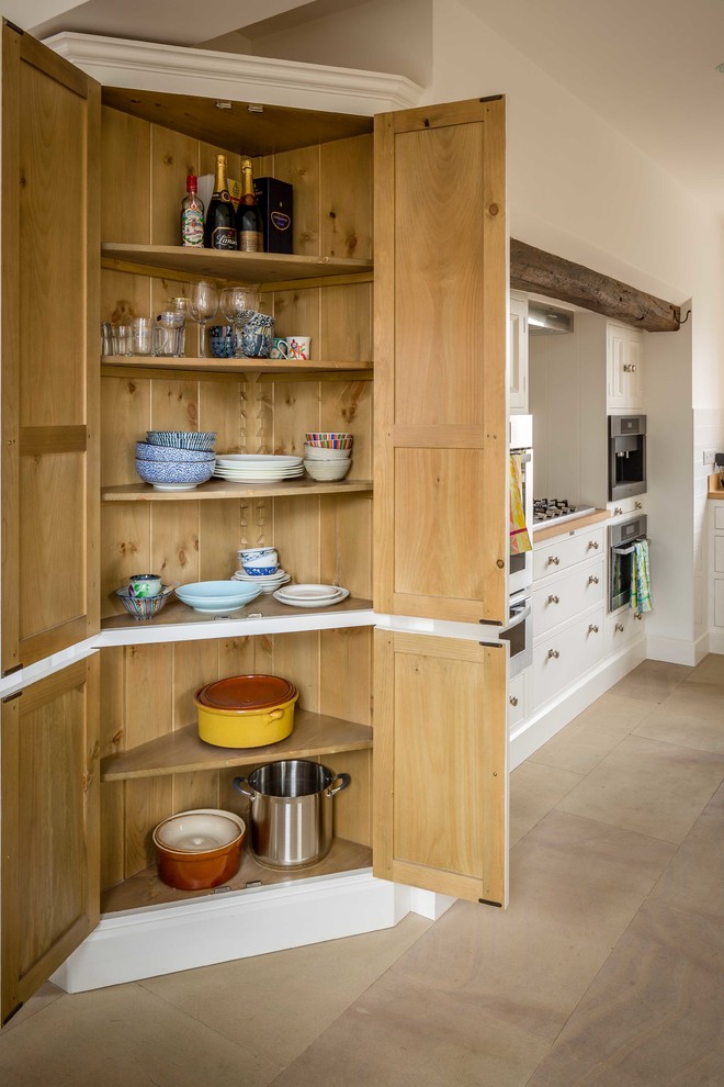 Design ideas for a large traditional kitchen pantry in Other.
