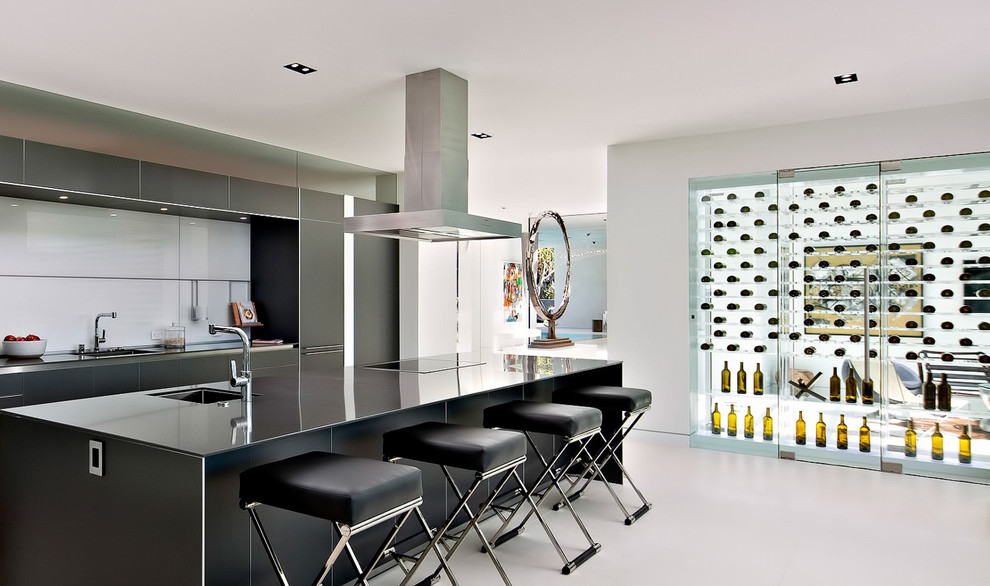 Inspiration for a mid-sized contemporary wine cellar in Los Angeles with concrete floors, storage racks and white floor.