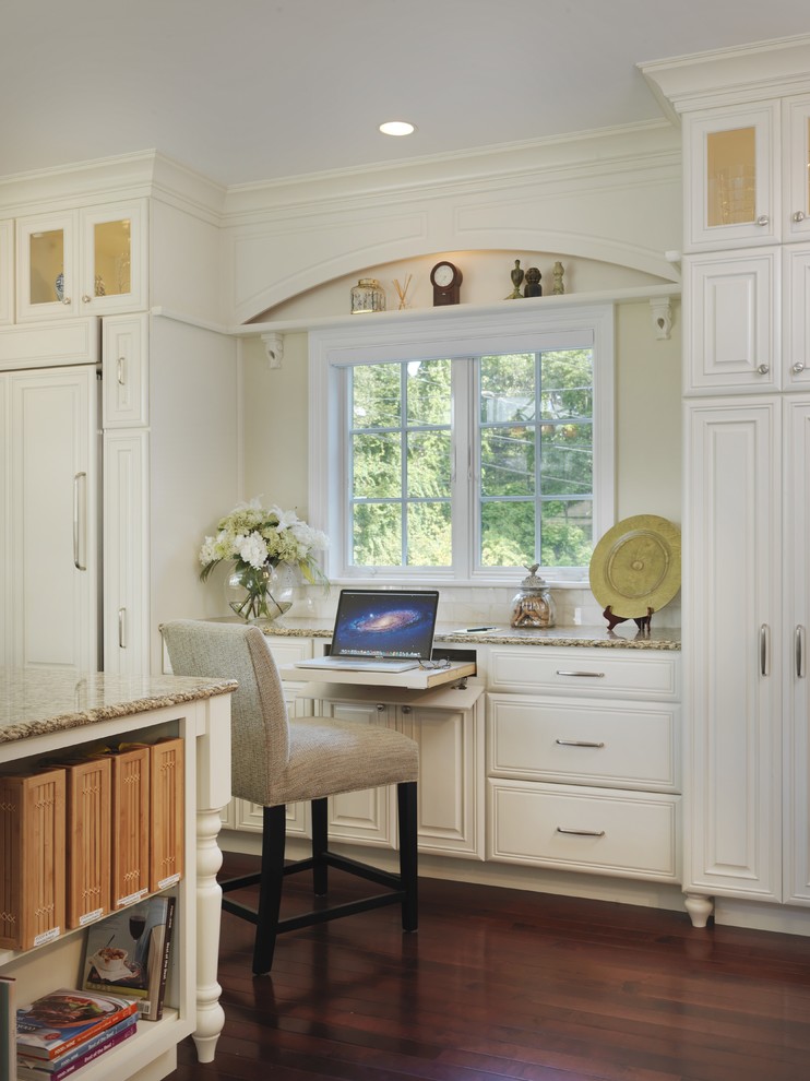 Inspiration for a traditional study room in Providence with white walls, medium hardwood floors and a built-in desk.