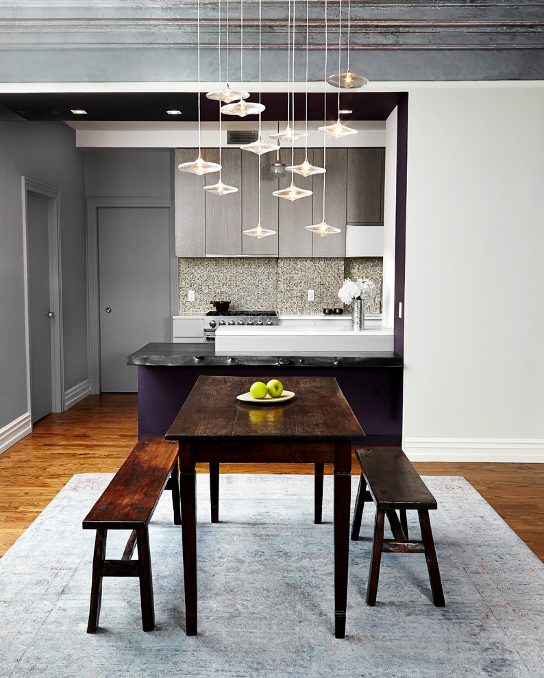 Inspiration for a mid-sized contemporary medium tone wood floor kitchen/dining room combo remodel in New York with gray walls and no fireplace