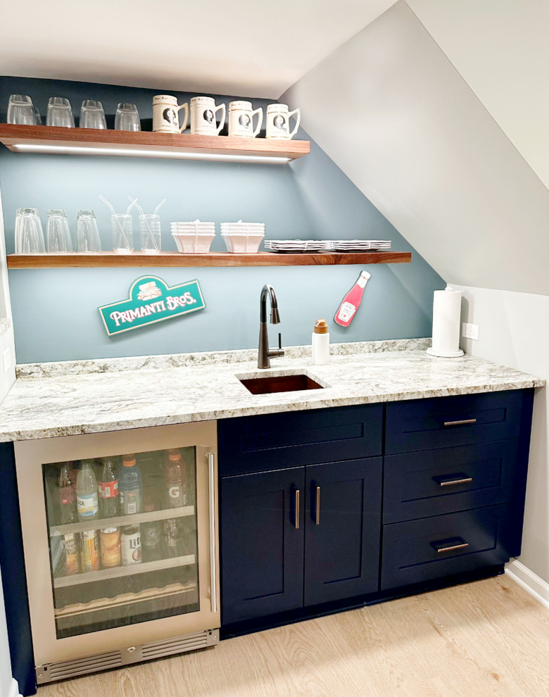 Inspiration for a transitional vinyl floor basement remodel