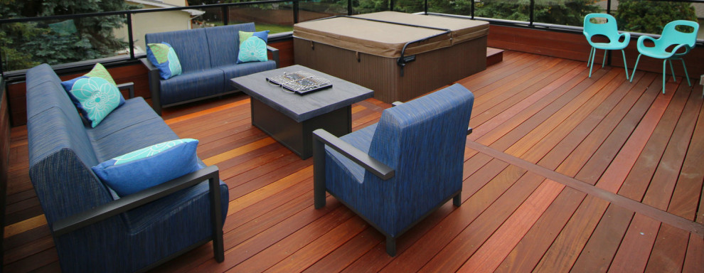 Deck - mid-sized transitional backyard deck idea in Calgary