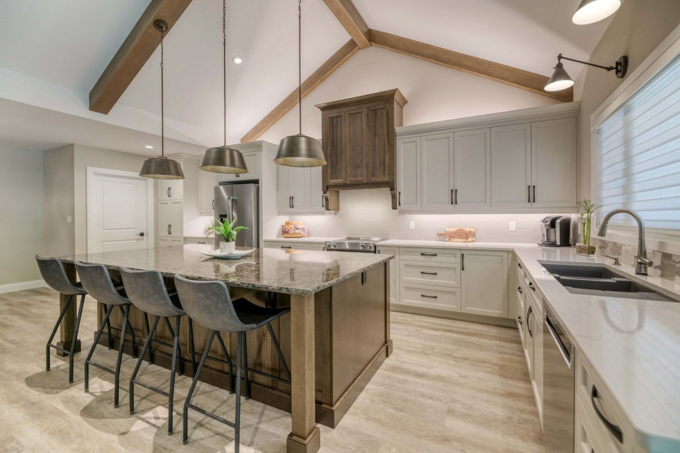 Inspiration for a large transitional eat-in kitchen remodel with an undermount sink, shaker cabinets, quartz countertops, porcelain backsplash, stainless steel appliances and an island
