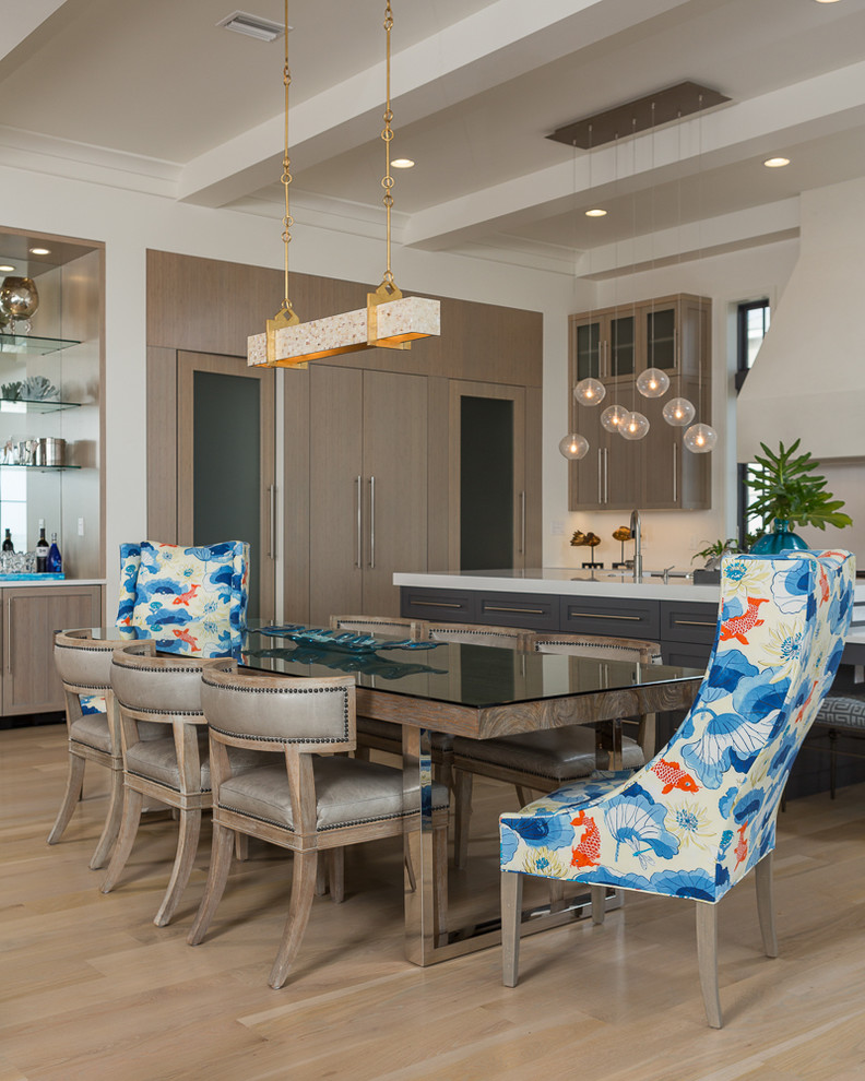 Large beach style kitchen/dining combo in Miami with white walls, light hardwood floors and no fireplace.