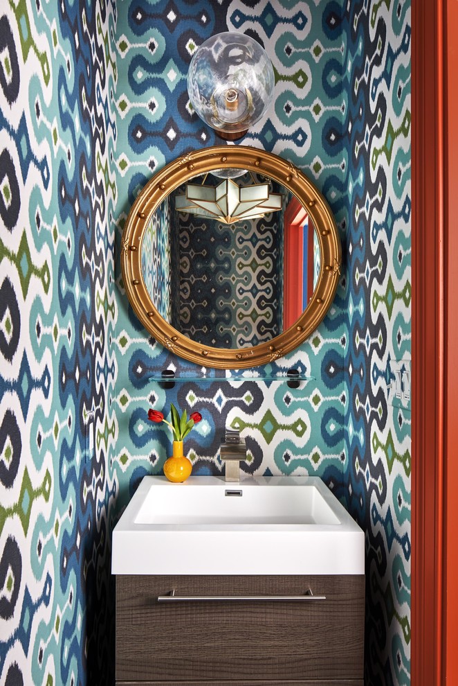 Inspiration for a small eclectic powder room in Boston with flat-panel cabinets, dark wood cabinets, multi-coloured walls and a console sink.