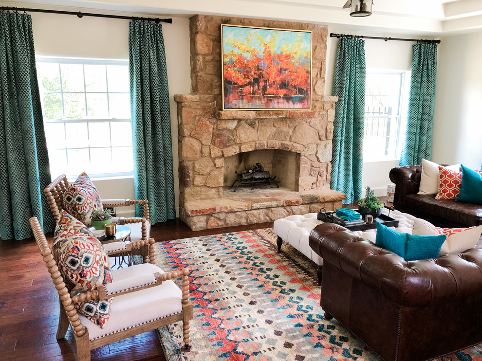 Inspiration for a mid-sized mediterranean formal enclosed living room in Austin with white walls, dark hardwood floors, a standard fireplace, a stone fireplace surround, no tv and brown floor.