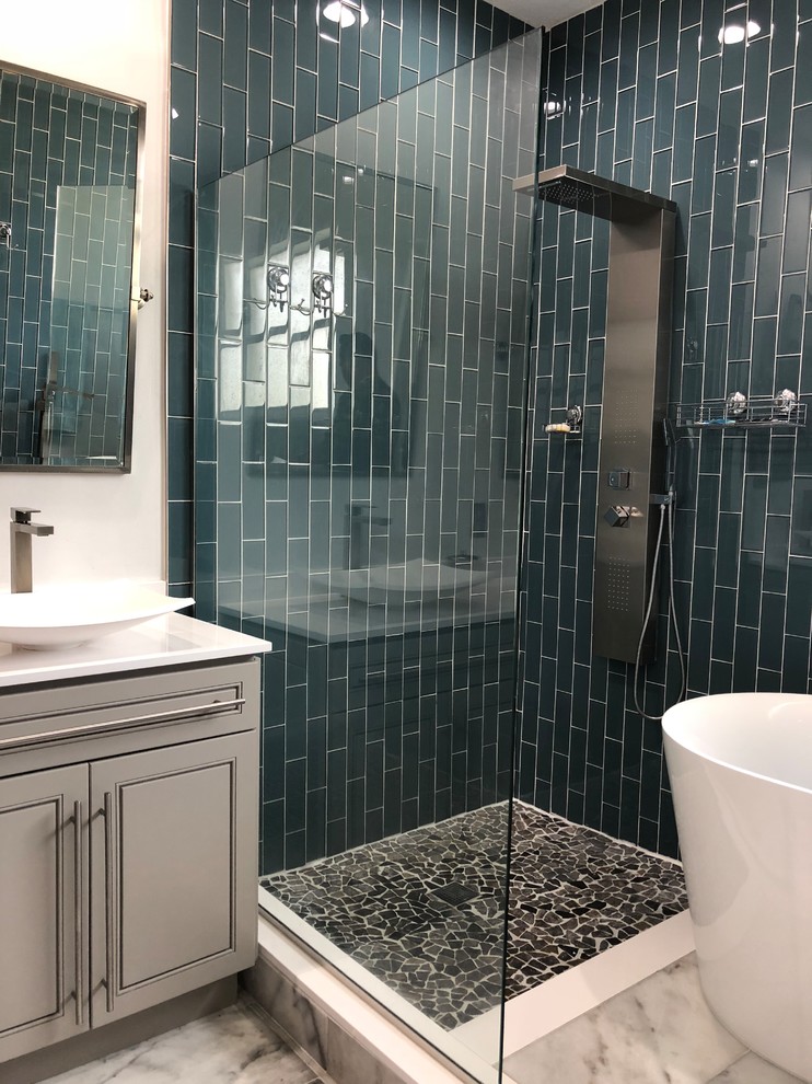 Inspiration for a mid-sized contemporary master bathroom in Miami with raised-panel cabinets, grey cabinets, a freestanding tub, a corner shower, white walls, marble floors, a vessel sink, white floor, a hinged shower door and white benchtops.