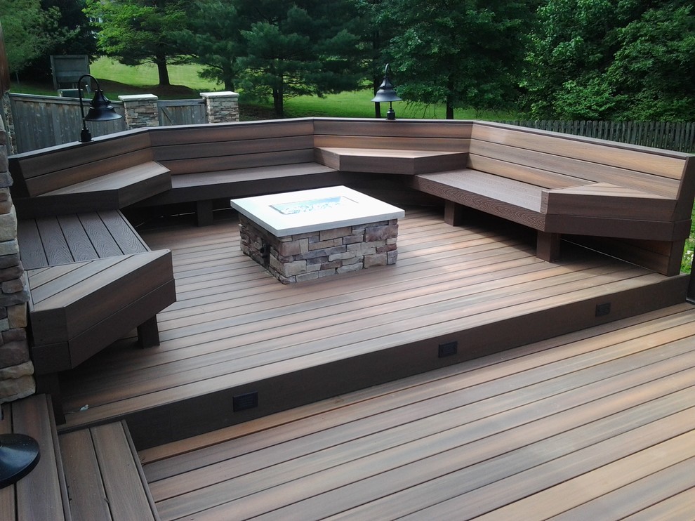 Inspiration for a large arts and crafts backyard deck in Indianapolis with no cover and a fire feature.