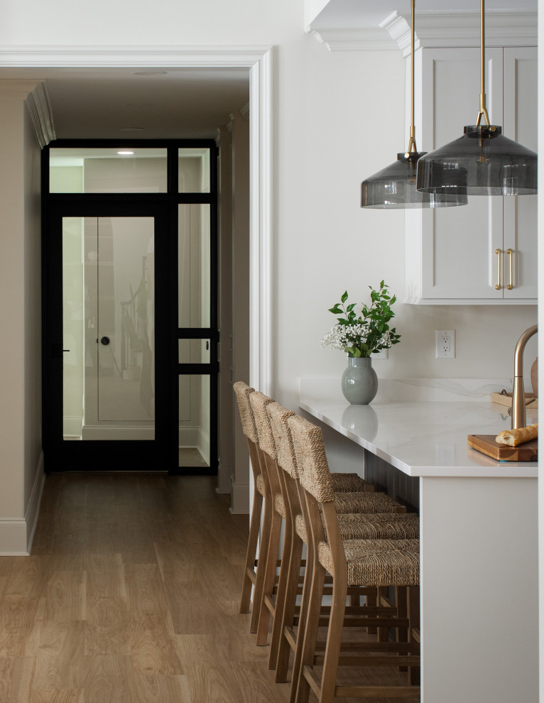 Example of a transitional home design design in Raleigh