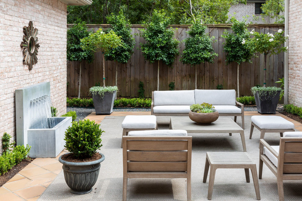 Design ideas for a transitional patio in Houston with a water feature and no cover.