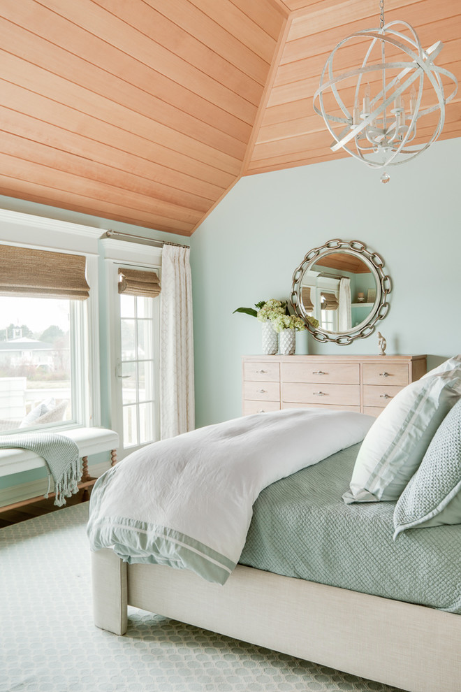 Beach style bedroom in Portland Maine with green walls and blue floor.