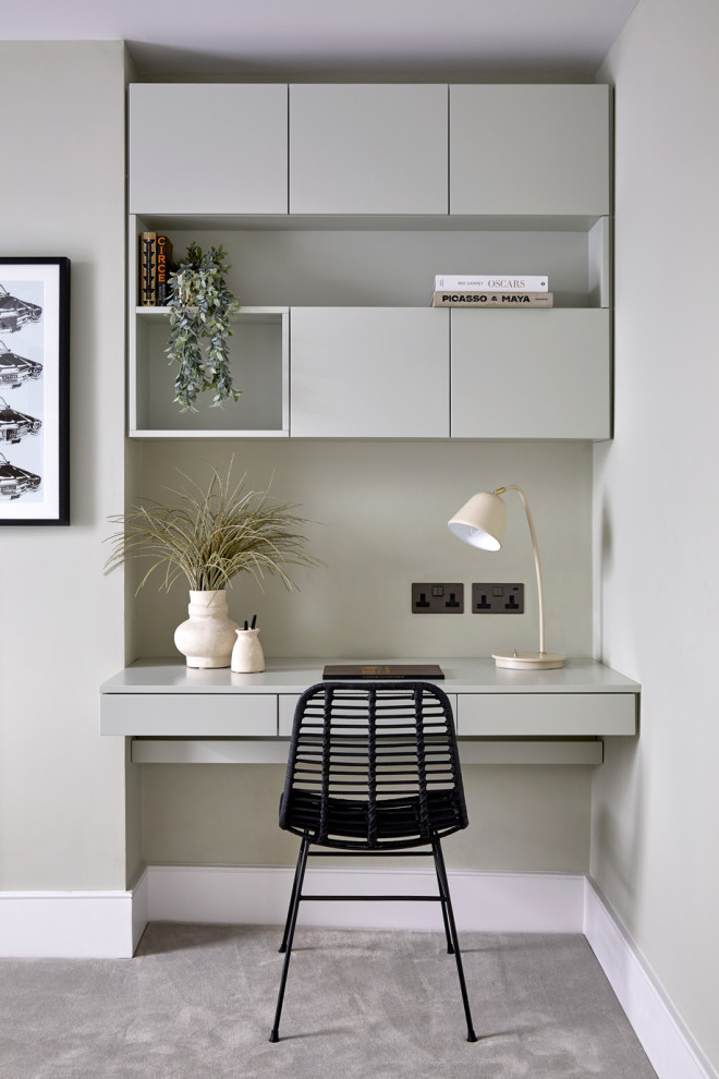 Design ideas for a small contemporary study room in London with green walls, carpet, a built-in desk and grey floor.