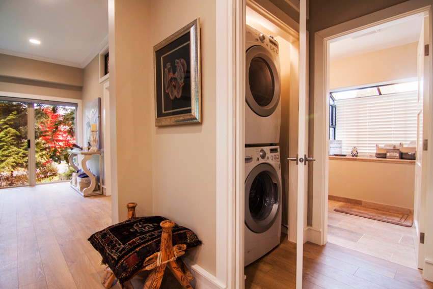 Eclectic laundry room photo in Vancouver